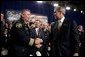 President George W. Bush greets firemen after remarks on homeland security at Northeastern Illinois Public Training Academy in Glenview, Illinois on Thursday July 22, 2004. White House photo by Paul Morse