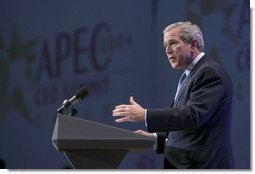 During an APEC summit, President George W. Bush addresses business executives at the CEO Summit in Santiago, Chile, Nov. 20, 2004. "I believe we must increase the flow of trade and capital. I know our societies must reward enterprise and open societies and open markets," President Bush said. "I know we've got to reject the blocks and barriers that divide economies and people. And I believe, with the right policies, we can continue to grow." White House photo by Eric Draper