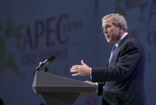 During an APEC summit, President George W. Bush addresses business executives at the CEO Summit in Santiago, Chile, Nov. 20, 2004. "I believe we must increase the flow of trade and capital. I know our societies must reward enterprise and open societies and open markets," President Bush said. "I know we've got to reject the blocks and barriers that divide economies and people. And I believe, with the right policies, we can continue to grow."White House photo by Eric Draper