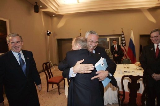 Secretary of State Colin Powell receives a warm reception from Russian President Vladimir Putin during a meeting with President Bush and delegation members including Deputy National Security Advisor Stephen Hadley, far right, in Santiago, Chile, Nov. 20, 2004. White House photo by Eric Draper