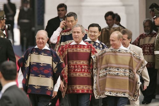 President George W. Bush walks with Chilean President Ricardo Lagos and Russian President Vladimir Putin to an APEC leaders group photo at La Moneda Presidential Palace in Santiago, Chile, Nov. 21, 2004. White House photo by Paul Morse