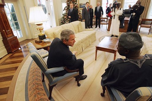 President George W. Bush talks with Nigerian President Olusegun Obasanjo in the Oval Office Thursday, Dec. 02, 2004. White House photo by Tina Hager.