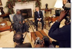 President George W. Bush meets with Nigerian President Olusegun Obasanjo in the Oval Office Thursday, Dec. 02, 2004. "I think it is vital that the continent of Africa be a place of freedom and democracy and prosperity and hope, where people can grow up and realize their dreams," President Bush said after the meeting. "It's a continent that has got vast potential, and the United States wants to help the people of Africa realize that potential."  White House photo by Tina Hager