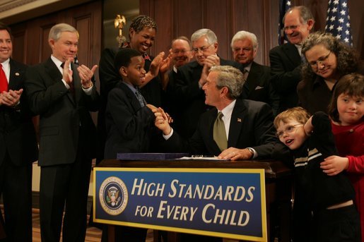 President George W. Bush greets Kyle Stevenson during signing ceremony for the Individuals with Disabilities Education Improvement Act of 2004 in the Dwight D. Eisenhower Executive Office Building in Washington, D.C., Friday, Dec. 3, 2004. The bill is intended to enhance learning by promoting accountability, parental involvement, and improved training for special education teachers. White House photo by Tina Hager