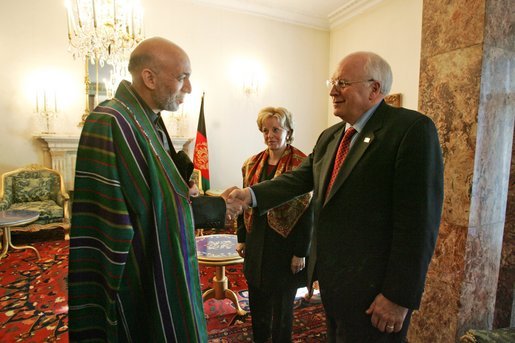 Vice President Dick Cheney shakes hands with newly-elected President Hamid Karzai of Afghanistan before departing Kabul, Afghanistan, Dec. 7, 2004. Vice President Dick Cheney and Lynne Cheney flew to Afghanistan to attend the historic swearing-in ceremony of President Karzai. White House photo by David Bohrer