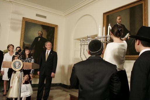 President George W. Bush and Laura Bush watch the lighting of the Menorah at the White House Thursday, Dec. 9, 2004. "We are honored to celebrate the miracle of Hanukkah in the White House this evening," said the President. White House photo by Paul Morse.