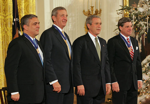 President George W. Bush stands with recipients of the Presidential Medal of Freedom during a ceremony in the East Room Tuesday, Dec. 14, 2004. From left, they are CIA Director George Tenet, Ambassador L. Paul Bremer III and U.S. Army General Tommy R. Franks. White House photo by Tina Hager