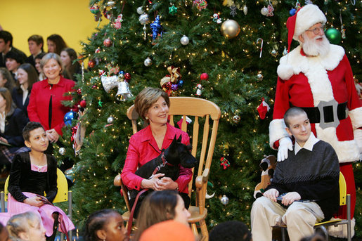 Brandy Robinson, Laura Bush , Barney Bush Keith "Koddie" Hernandez and Santa Claus watch the first viewing of the 2004 BarneyCam during the Children's National Medical Center holiday program in Washington, D.C., Wednesday, Dec. 15, 2004. White House photo by Susan Sterner
