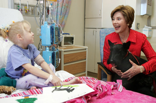 Laura Bush and her Scottish Terrier, Barney, visit with Carly Batchelder,8, a patient at Children's National Medical Center in Washington, D.C., Wednesday, Dec. 15, 2004. White House photo by Susan Sterner