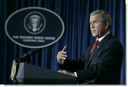 President George W. Bush speaks to the media in Crawford, Texas during a statement on the recent earthquake and Tsunami disasters, Wednesday, Dec. 29, 2004.  White House photo by Eric Draper