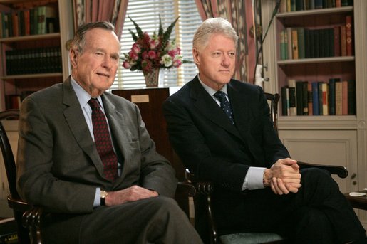 Former Presidents George H. W. Bush and Bill Clinton film a public service announcement encouraging the American people to make cash donations to the tsunami relief effort through www.usafreedomcorps.gov in the White House Library Wednesday, Jan. 5, 2005. White House photo by Eric Draper.