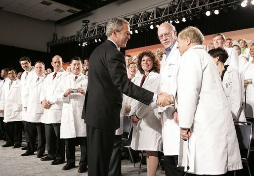 President George W. Bush greets physicians after discussing medical liability reform during a visit to Collinsville, Ill., Wednesday, Jan. 5, 2005. White House photo by Paul Morse.