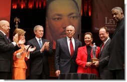Secretary of State Colin Powell and his wife Alma are accompanied by President George W. Bush and Mrs. Laura Bush while the Powell's received the John Thompson Legacy of a Dream Award from Georgetown University during the University's "Let Freedom Ring" celebration honoring Dr. Martin Luther King, Jr. at the Kennedy Center for the Performing Arts on Monday, January 17, 2005.  White House photo by Paul Morse