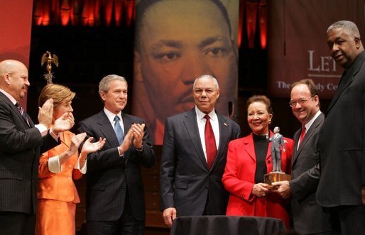 Secretary of State Colin Powell and his wife Alma are accompanied by President George W. Bush and Mrs. Laura Bush while the Powell's received the John Thompson Legacy of a Dream Award from Georgetown University during the University's "Let Freedom Ring" celebration honoring Dr. Martin Luther King, Jr. at the Kennedy Center for the Performing Arts on Monday, January 17, 2005. White House photo by Paul Morse.
