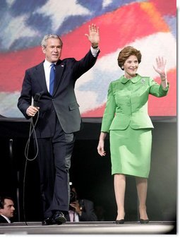 President George W. Bush and Laura Bush wave to young supporters during the pre-inaugural event 'America's Future Rocks Today- A Call to Service' youth event at the DC Armory in Washington, D.C., Tuesday, Jan. 18, 2005. The event highlighted the importance of volunteerism and community service in America's neighborhoods.  White House photo by Susan Sterner
