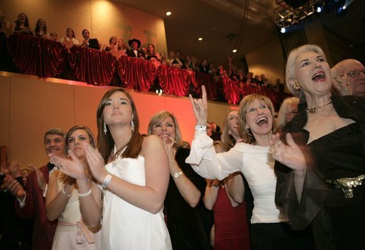Audience members display the Texas Longhorn symbol in support of President Bush during the Texas State Society's Black Tie and Boots Inaugural Ball in Washington, D.C., Wednesday, Jan. 19, 2005. White House photo by Paul Morse