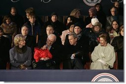 President George W. Bush and Laura Bush sit with Vice President Dick Cheney, Lynne Cheney, and their granddaughter, Grace Perry, during a concert commemorating the 55th Presidential Inauguration on the Ellipse in Washington, D.C., Wednesday, Jan. 19, 2005. White House photo by Eric Draper.