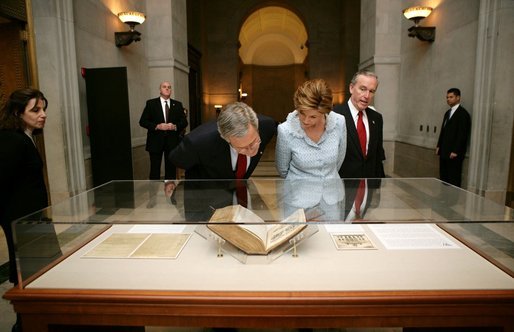 President George W. Bush and Laura Bush tour the National Archives in Washington, D.C., Wednesday, Jan. 19, 2005. National Archives Senior Curator Stacy Bredhoff, left, and National Archivist John Carlin, right, escorted the Bushes during their visit. White House photo by Eric Draper