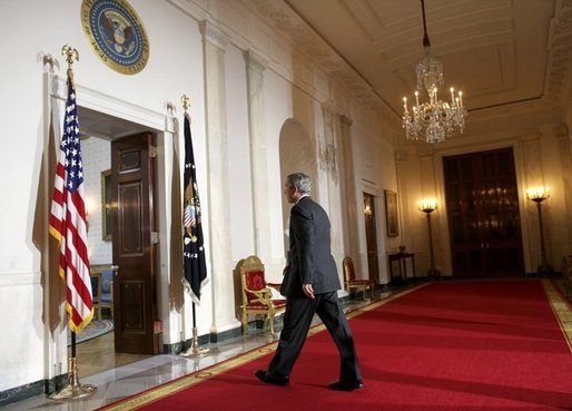 President George W. Bush leaves the podium after delivering a statement on Iraq's elections from the Cross Hall of the White House, Sunday, Jan. 30, 2005. White House photo by Eric Draper.