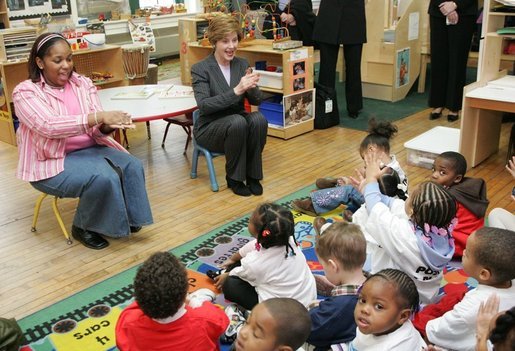 Laura Bush joins pre-school teacher Georgianna Ragland's class in a song during her visit to the Germantown Boys and Girls Club Tuesday, Feb. 3, 2005 in Philadelphia. Mrs Bush highlighted the importance of programs that support youth, especially at-risk boys. White House photo by Susan Sterner