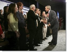 President George W. Bush greets audience members at the end of the Town Hall on Strengthening Social Security at the Tampa Convention Center in Tampa, Florida, Friday, Feb. 4, 2005. 