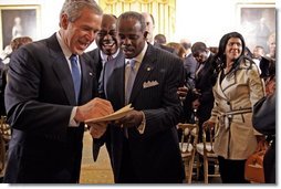 After speaking, President Bush greets guests during a ceremony honoring February as African American History Month Tuesday, Feb. 8, 2005.   White House photo by Paul Morse