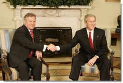 President George W. Bush welcomes Poland's President Aleksander Kwasniewski to the Oval Office Wednesday, Feb. 9, 2005. During their visit, President Kwasniewski spoke about the optimism of his government regarding the future of Iraq.  White House photo by Eric Draper