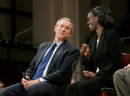 President George W. Bush and Dawn Baldwin, an English teacher at Lenior Community College in Kinston, N.C., exchange smiles during a town hall meeting on strengthening Social Security in Raleigh, N.C., Thursday, Feb. 10, 2005. White House photo by Eric Draper