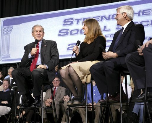 President George W. Bush shares a laugh with stage participants Frank Partin, right, and his daughter Amy during a Conversation on Strengthening Social Security at the Pease International Tradeport Airport, Wednesday, Feb. 16, 2005. White House photo by Eric Draper