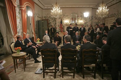 Attending a bilateral meeting, Presidents George W. Bush and Jacques Chirac of France address the press at the Ambassador's Residence, Brussels, Belgium, Monday, Feb. 21, 2005. White House photo by Eric Draper White House photo by Eric Draper.
