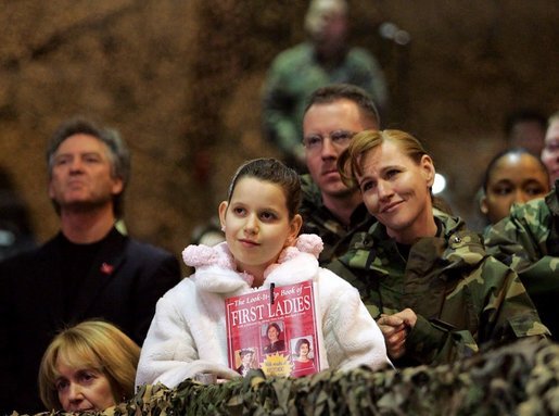 Audience members listen to a speech by Laura Bush praising the sacrifice and hard work of the U.S. military and their families Tuesday, Feb. 22, 2005 at Ramstein Air Base in Ramstein, Germany. White House photo by Susan Sterner