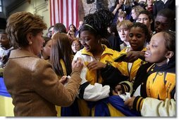 Laura Bush signs autographs for students of General H. H. Arnold High School following her remarks there to students, faculty and parents of the military in Wiesbaden, Germany, Tuesday, Feb. 22, 2005.   White House photo by Susan Sterner