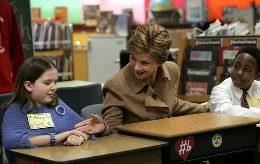 Mrs Bush greets Hainerberg Elementary School student Hailey Cook during her visit with fourth and fifth graders Tuesday, Feb. 22, 2005 in Wiesbaden, Germany. White House photo by Susan Sterner