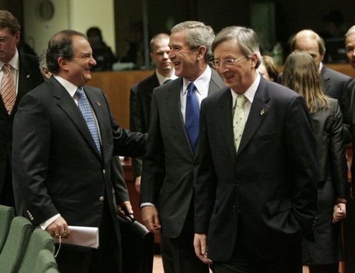 President George W. Bush laughs with Greek Prime Minister Costas Karamanlis, left, during a meeting at the European Union Council building in Brussels, Tuesday Feb. 22, 2005. White House photo by Eric Draper