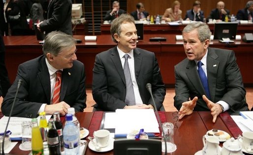 During a meeting with European Union Leaders at the EU Council Building in Brussels, President George W. Bush talks with Austrian Chancellor Wolfgang Schuessel, left, of Austria, and Prime Minister Blair of Britain,Tuesday, Feb. 22, 2005. White House photo by Eric Draper