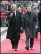 President George W. Bush and German Chancellor Gerhard Schroeder wave to the crowd during an official arrival ceremony at the Electoral Palace in Mainz, Germany, Wednesday, Feb. 23, 2005. White House photo by Eric Draper