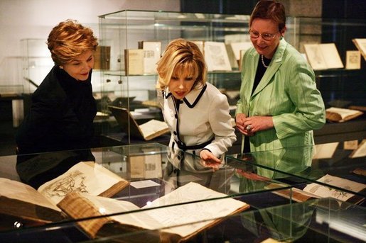Laura Bush and Mrs. Schroeder-Koepf, center, view the Gutenberg Bible during a visit to the Gutenberg Museum in Mainz, Germany, Wednesday, Feb. 23, 2005. White House photo by Susan Sterner