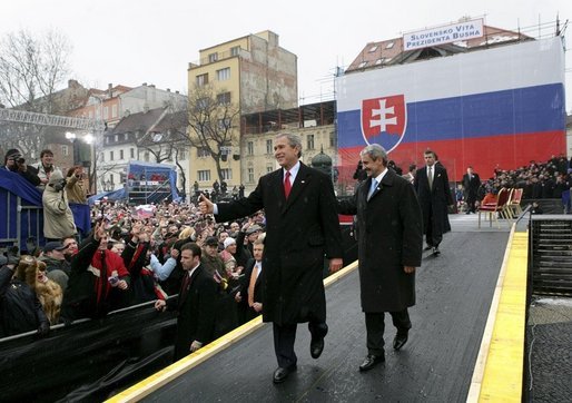 President George W. Bush gives his thumbs up as he leaves the stage with Prime Minister Mikulas Dzurinda of Slovakia after speaking at Hviezdoslavovo Square in Bratislava, Slovakia, Thursday, Feb. 24, 2005. White House photo by Eric Draper