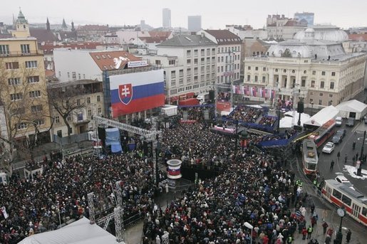 President George W. Bush and Slovakia’s Prime Minister Mikulas Dzurinda are greeted by a crowd of thousands gathered in Bratislava's Hviezdoslavovo Square, February 24, 2005. White House photo by Paul Morse