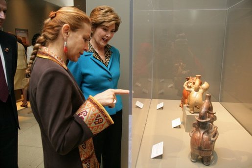 Elaine Karp de Toledo, First Lady of Peru, explains artifacts on display to Laura Bush during a visit to view the exhibit "Peru: Indigenous and Viceregal," at the National Geographic Society Friday, Feb. 25, 2005 in Washington, D.C. Also present is John Fahey, Jr., President and CEO of National Geographic Society. White House photo by Susan Sterner