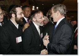 President George W. Bush greets attendees during a White House Faith-Based and Community Initiatives Leadership Conference in Washington, D.C., Tuesday, March 1, 2005.  White House photo by Paul Morse