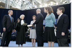 President George W. Bush watches as U.S. Supreme Court Justice Sandra Day O’Connor swears in Michael Chertoff as Secretary of Homeland Security during a ceremony Thursday, Mar. 3, 2005, at the Ronald Reagan Building and International Trade Center in Washington, D.C. On stage with Mr. Chertoff is his wife Meryl, center, and their two children Philip and Emily.  White House photo by Paul Morse