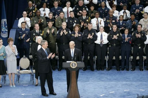 President George W. Bush and guests applaud Secretary Michael Chertoff after he was sworn in as the second Secretary of Homeland Security Thursday. Mar. 3, 2005. White House photo by Paul Morse