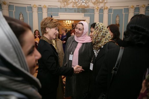 Laura Bush greets Afghan Ministers during her visit to the State Department for an International Women's Day Forum in Washington, D.C., Tuesday, March 8, 2005. White House photo by Susan Sterner