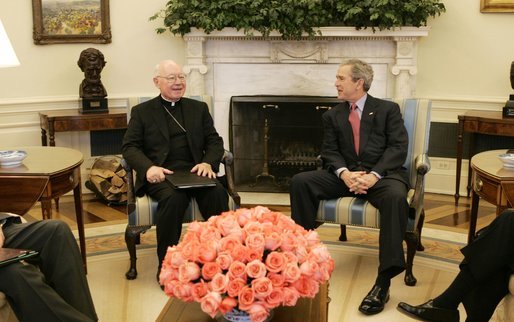 President George W. Bush talks with Bishop William Skylstad, newly elected president of the U.S. Conference of Catholic Bishops, in the Oval Office Monday, March 14, 2005. In November 2004, Bishop Skylstad was elected to a three-year term as head of the USCCB, which serves to promote, coordinate and encourage Catholic activities in the United States. White House photo by Krisanne Johnson