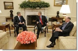 President George W. Bush meets with Deputy Secretary of Defense Paul Wolfowitz and Secretary of Treasury John Snow in the Oval Office Wednesday, March 16, 2005.  White House photo by Paul Morse