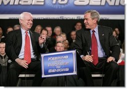 President George W. Bush and Senator John McCain, R-Ariz., participate on stage Monday, March 21, 2005, during a Conversation on Strengthening Social Security at the Wings Over the Rockies Air and Space Museum in Denver.  White House photo by Eric Draper