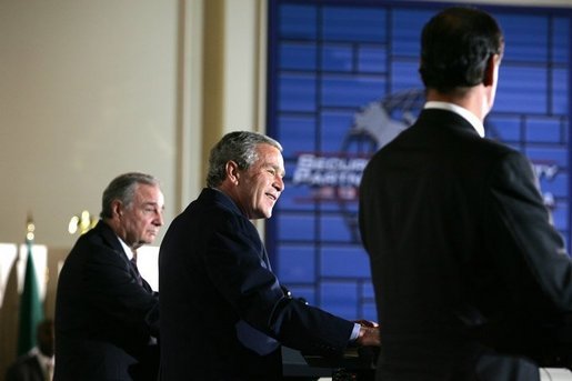 President George W. Bush smiles during a joint press conference Wednesday, March 23, 2005, after talks with Canada's Prime Minister Paul Martin, left, and Mexico's President Vicente Fox at the Bill Daniels Activity Center on the campus of Baylor University in Waco, Texas. White House photo by Krisanne Johnson