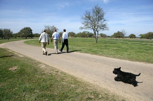 As Barney follows along, President George W. Bush walks with Canadian Prime Minister Paul Martin, left, and Mexican President Vicente Fox in Crawford, Texas, March 23, 2005. White House photo by Eric Draper White House photo by Eric Draper