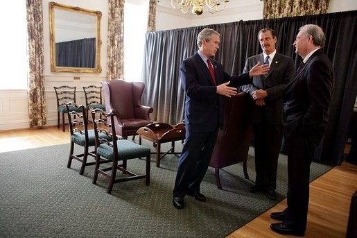 President George W. Bush talks privately with Mexican President Vicente Fox, center, and Canadian Prime Minister Paul Martin, right, during a March 23, 2005, trilateral meeting at Baylor University in Waco, Texas. White House photo by Eric Draper White House photo by Eric Draper
